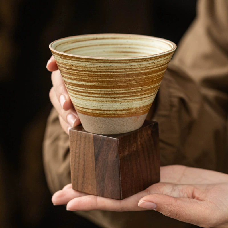 Artisan coffee dripper cup on polished cube base
