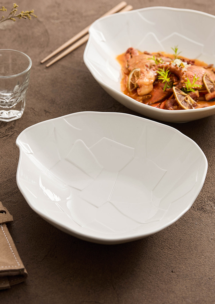 Artisan tableware showcasing the quiet perfection of form and organic shapes.