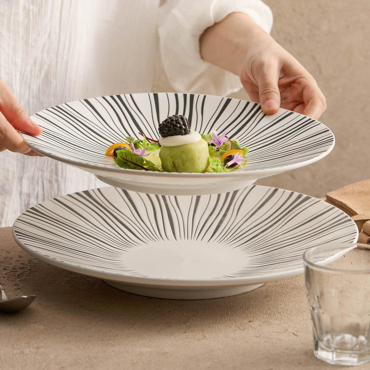 Artistic ceramic dish with radial brushstroke pattern