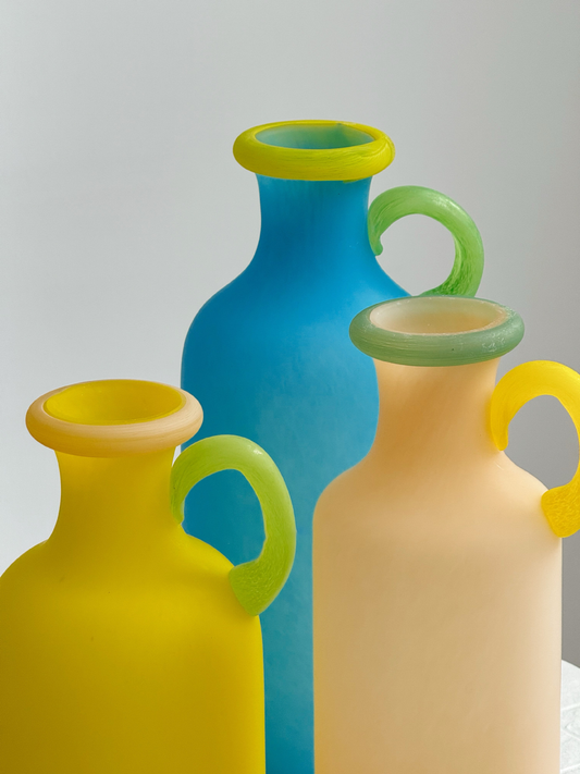 Blue frosted glass decorative bottle vase with loop handle