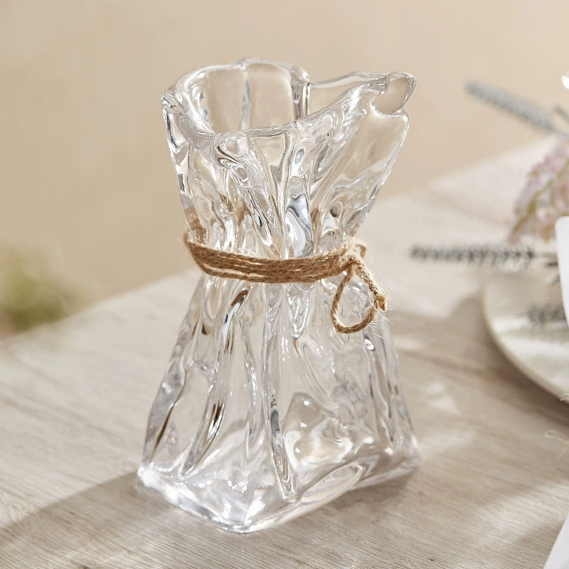Clear glass vase with sculptural crumpled shape