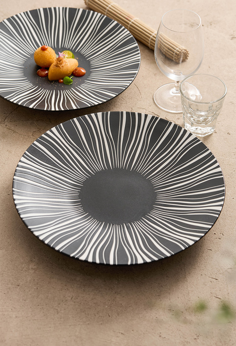 Close-up of black plate with radiating white lines