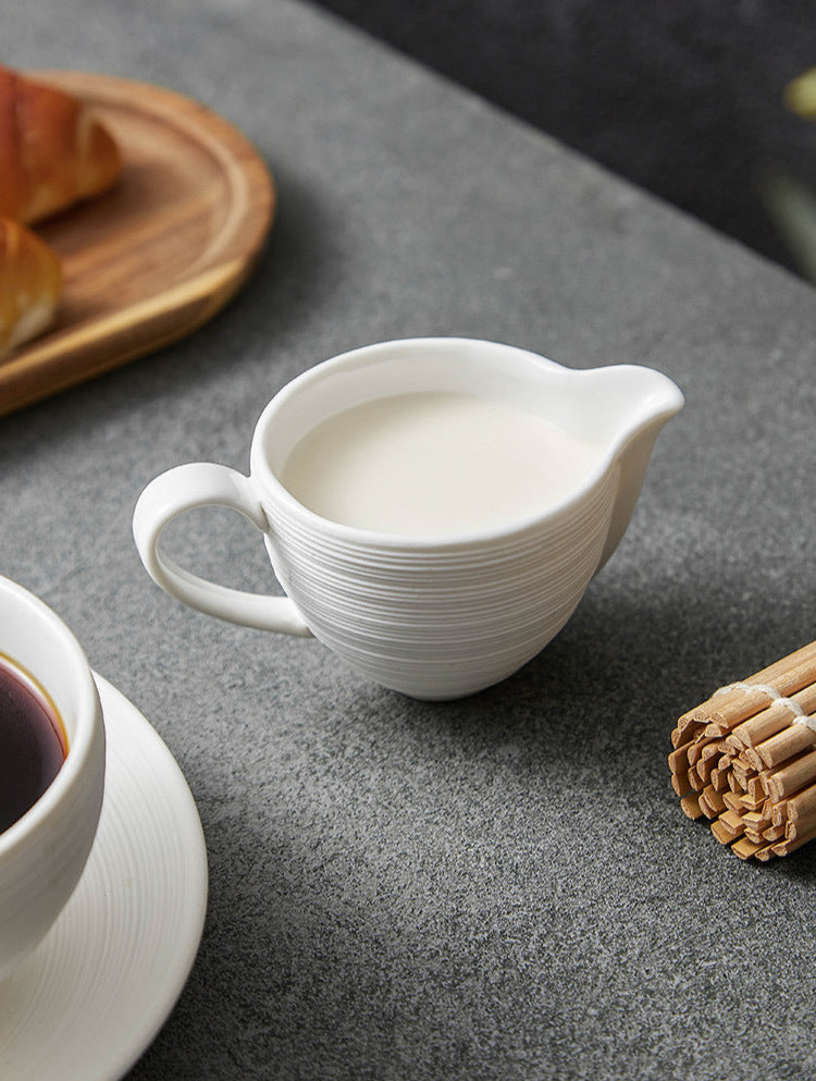Close-up of minimalist milk jug with pouring spout