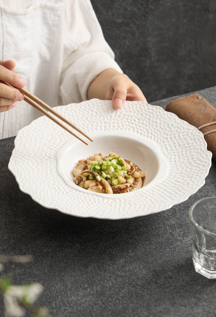 Close-up of sculptural ceramic plate with layered design