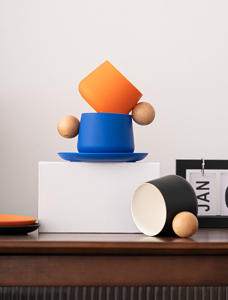 Colorful coffee mugs with spherical wood handles