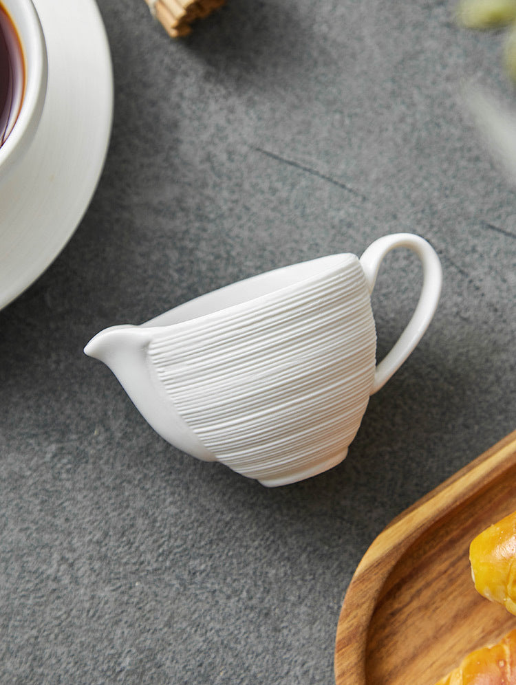 Compact ceramic cream jug for stylish dining