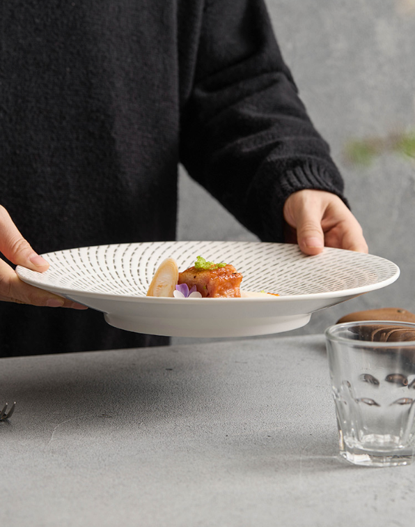 Contemporary ceramic dish with black dotted rings