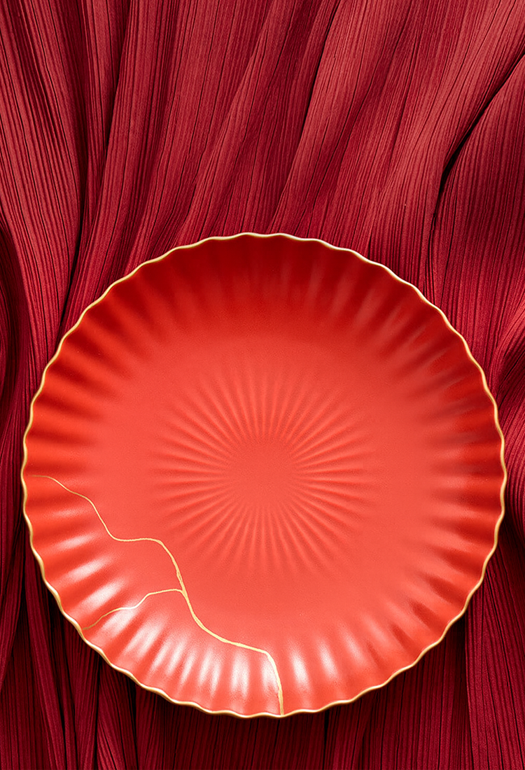 Contemporary red ceramic wave-edge bowl for kitchen use