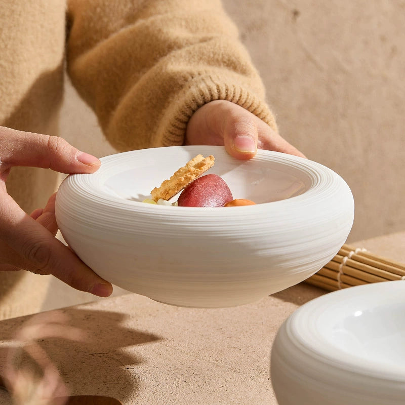 Creative layered ceramic bowl on wooden dining table