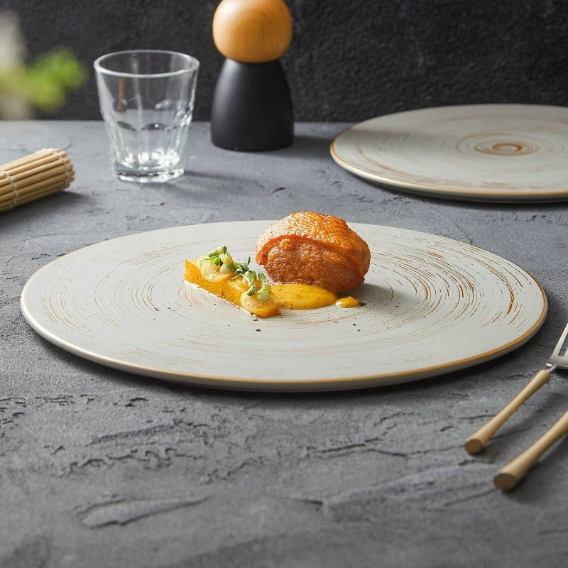 Designer round plate with textured surface detail