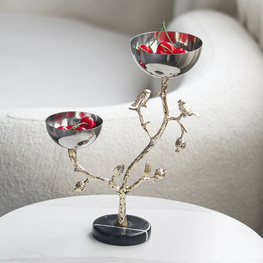 Dual stainless steel bowls on artistic tree branch sculpture