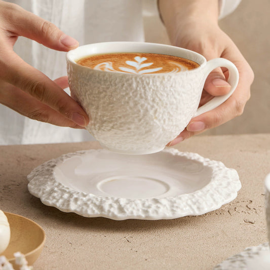 Elegant handcrafted ceramic cafe mug with matching saucer