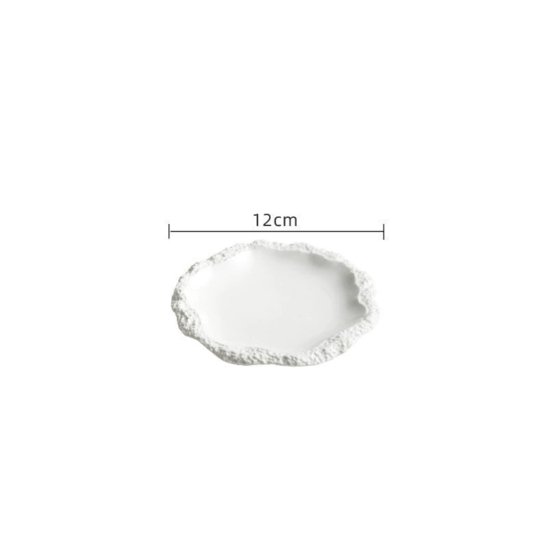 Elegant stone-textured dinner plate on linen table