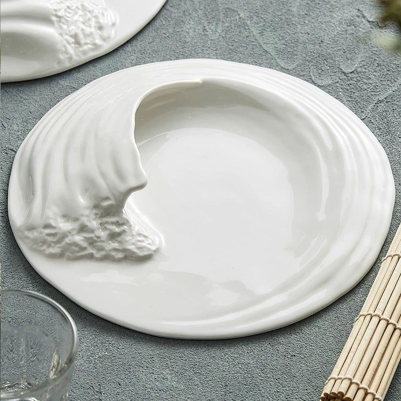 Elegant wave ceramic platter used in fine dining presentation
