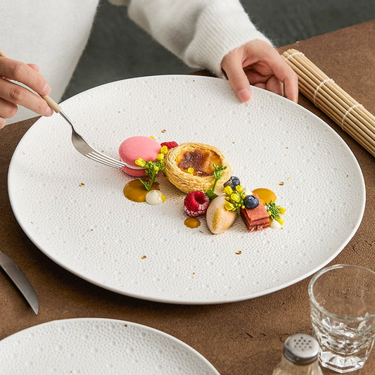 Fine dining presentation on textured ceramic plate