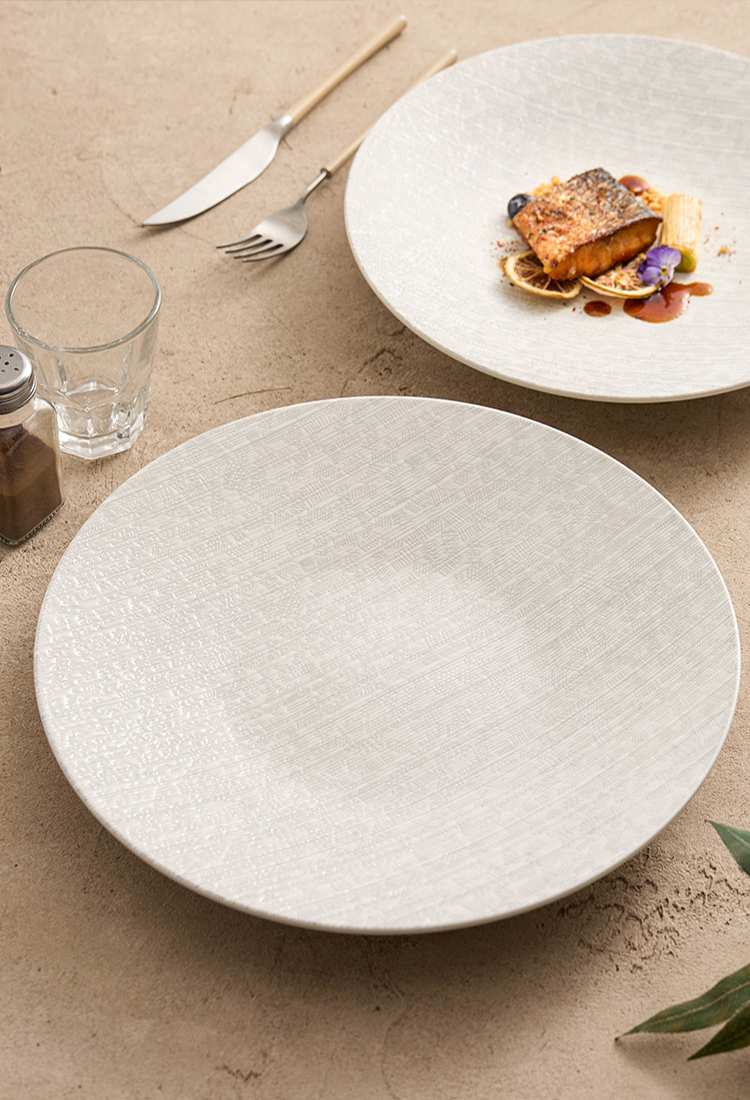 Fine dining presentation plate with subtle striped surface