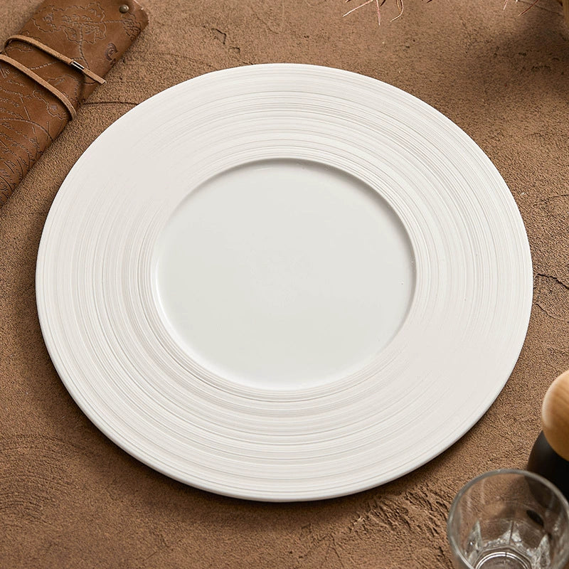 Flat modern plate with wide border and subtle grooves