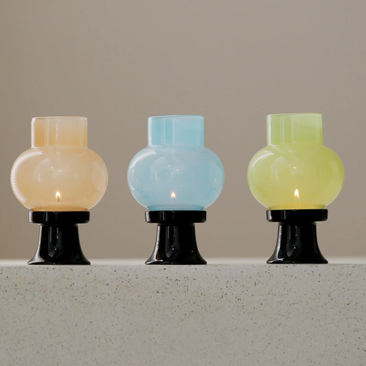 Hand-blown borosilicate glass aromatherapy lamp emitting soft ambient light.