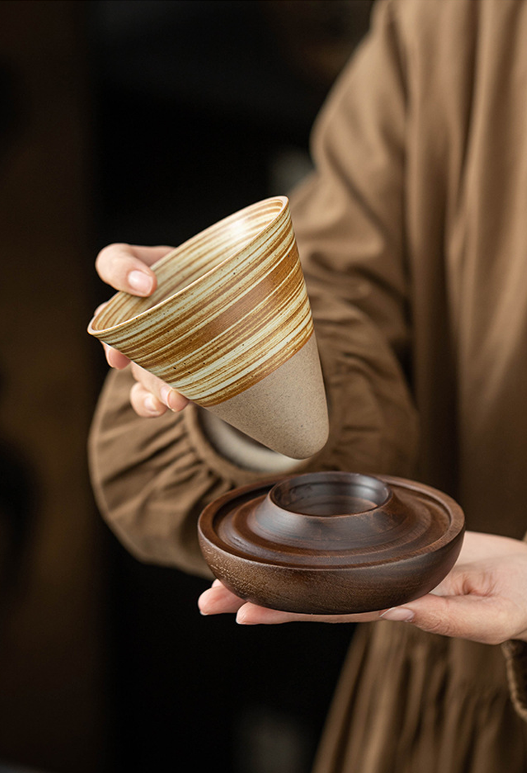 Hand-thrown ceramic cup with fine grooved texture
