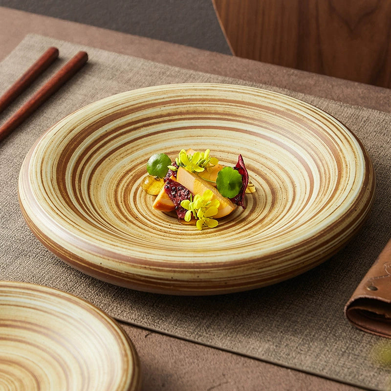Handcrafted ceramic dinner plate with brown swirl pattern