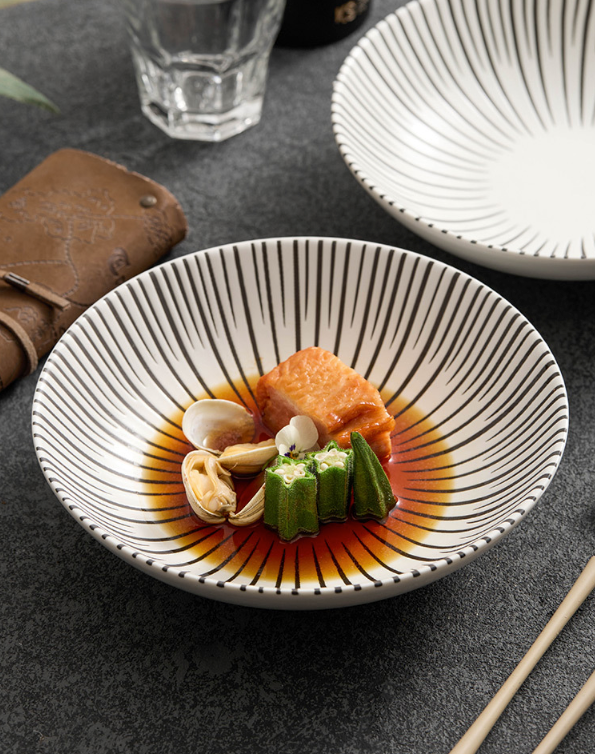 Handcrafted look ceramic plate with linear design