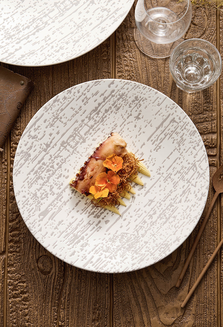 Handmade-look ceramic plate with organic texture