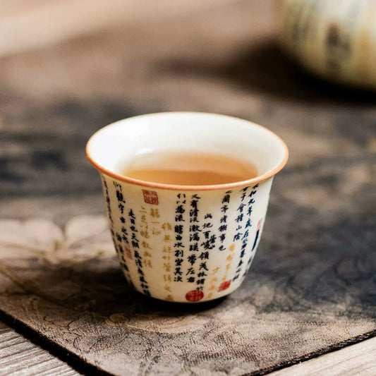 High-fired porcelain cup with calligraphy