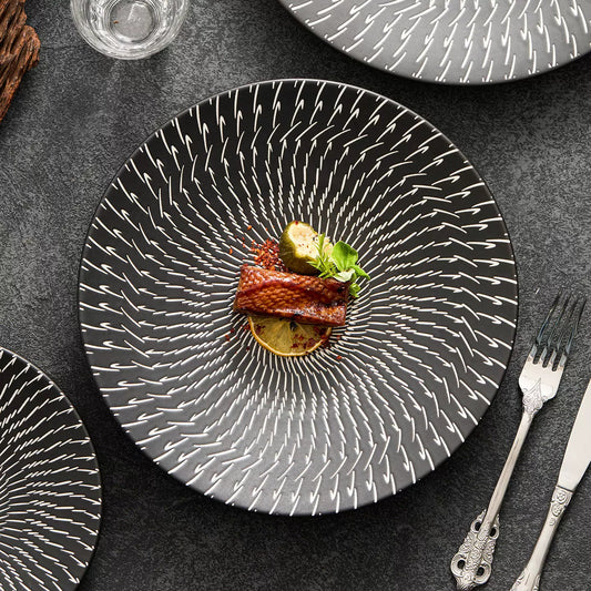 High-fired porcelain dinner plate featuring elegant radial lines