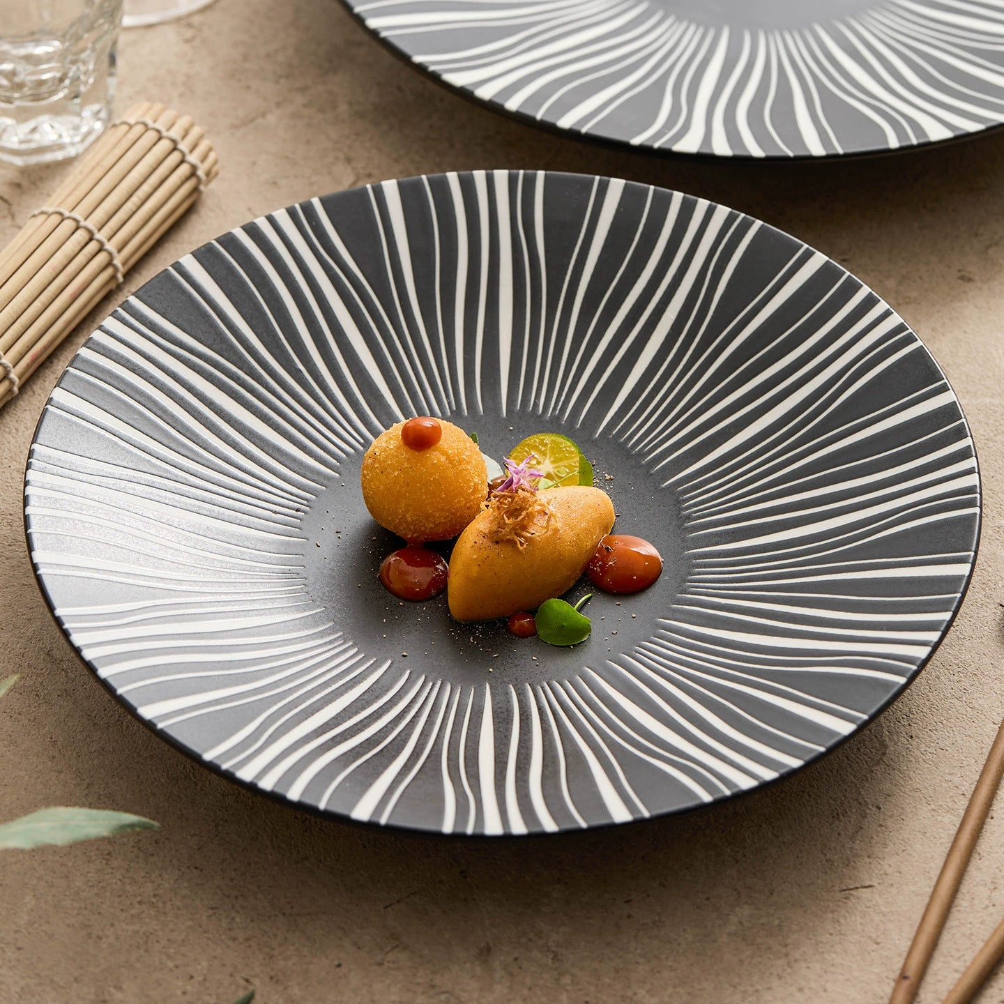 Matte black round plate with artistic line texture