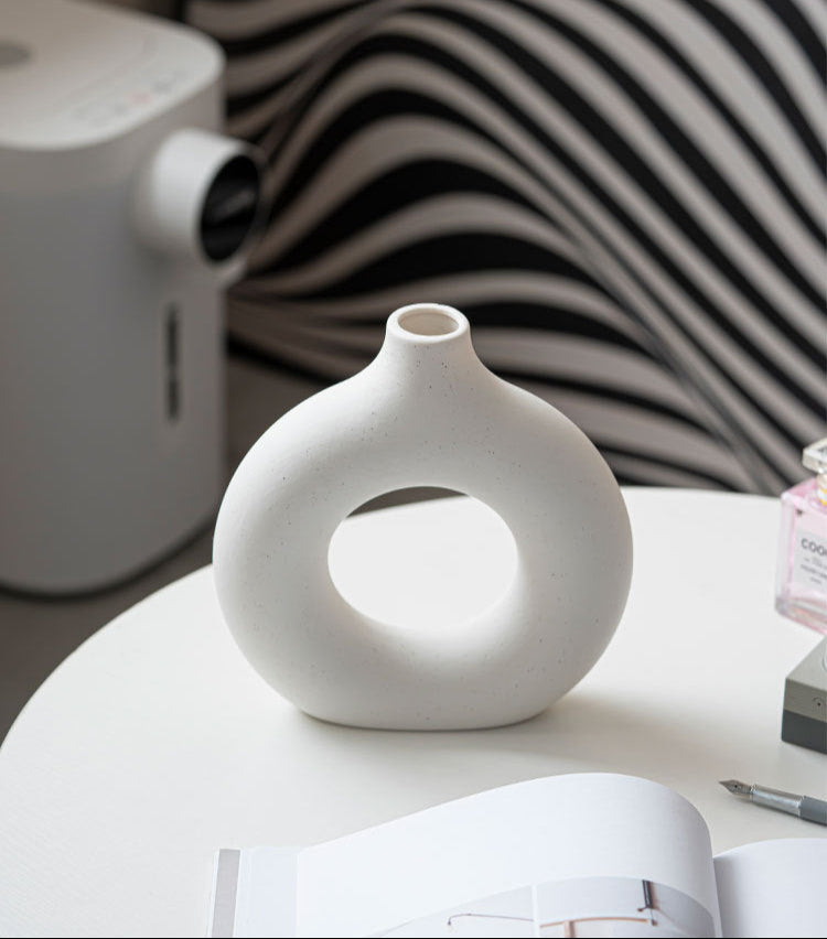 Contemporary white donut-shaped vases for living room styling