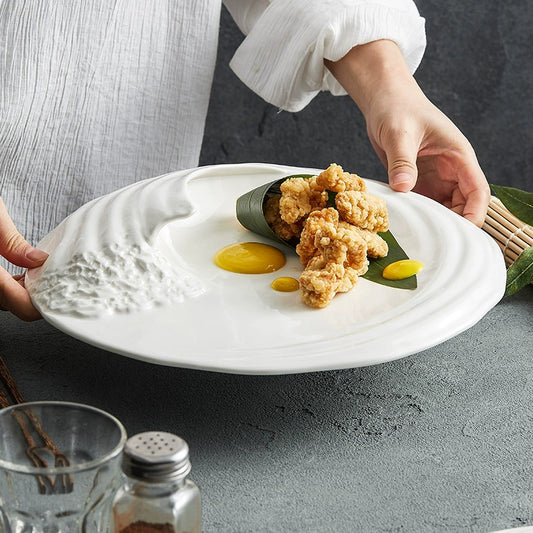 Minimalist artistic flat plate on wood table with cutlery