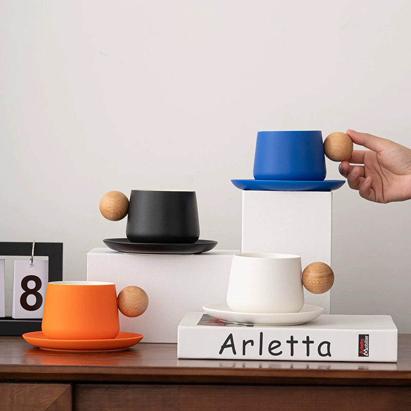 Minimalist ceramic coffee cup with wooden ball handle
