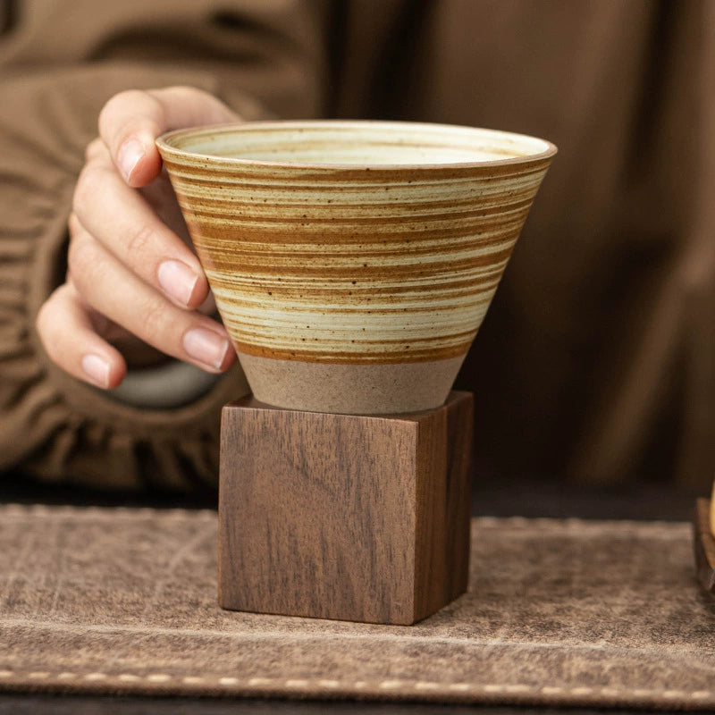 Minimalist ceramic cup and wood base set for coffee or tea
