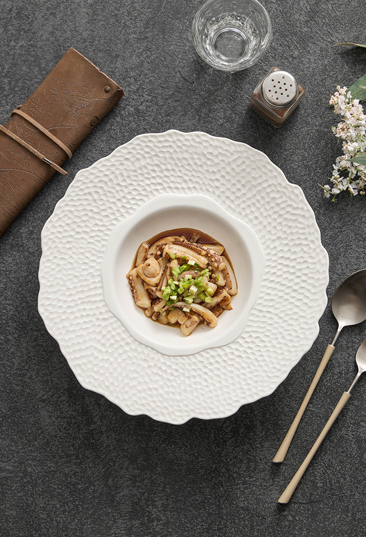 Modern ceramic plate on dark stone table setting