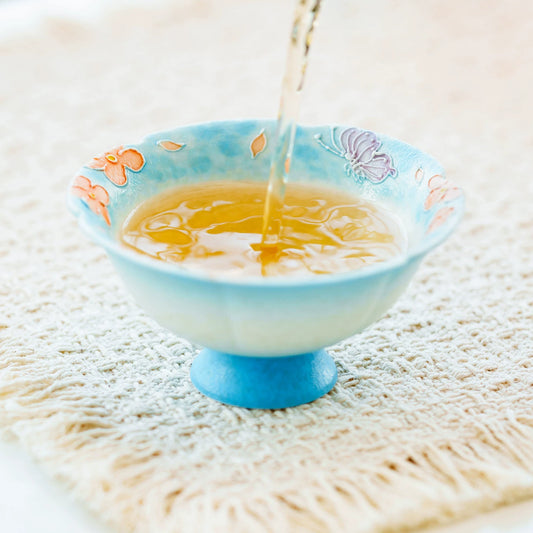 Pedestal base ceramic tea tasting cup