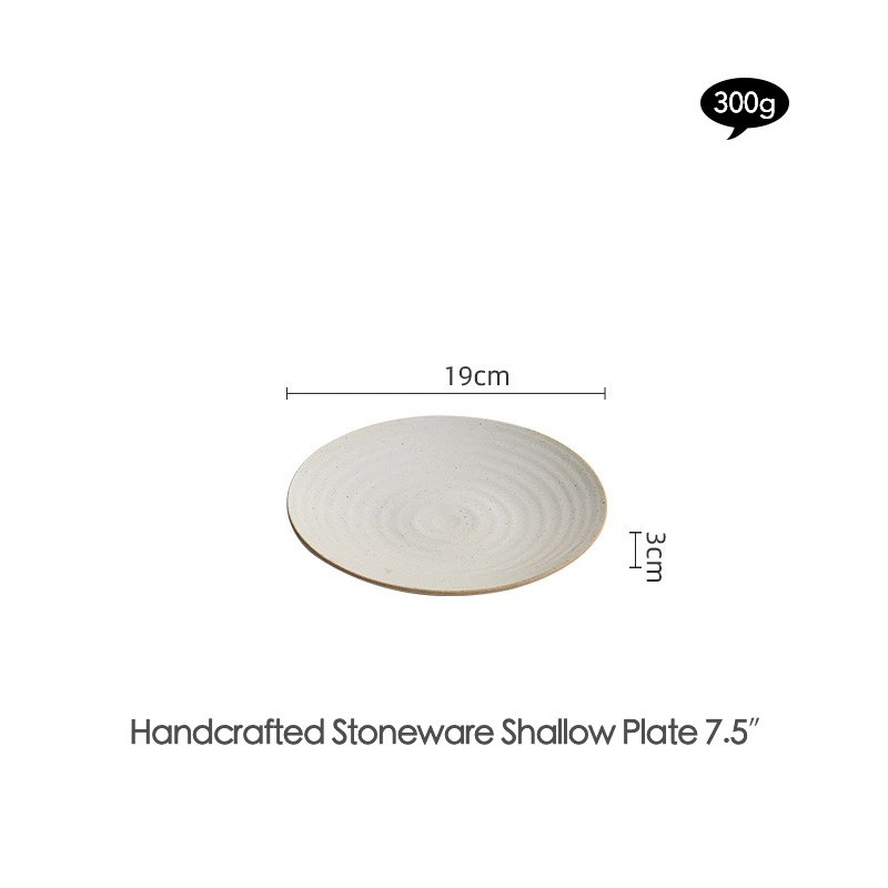 Round ceramic serving plate with subtle textured surface