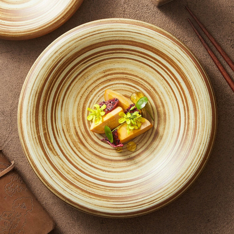 Shallow round plate for pasta or salad in natural tones