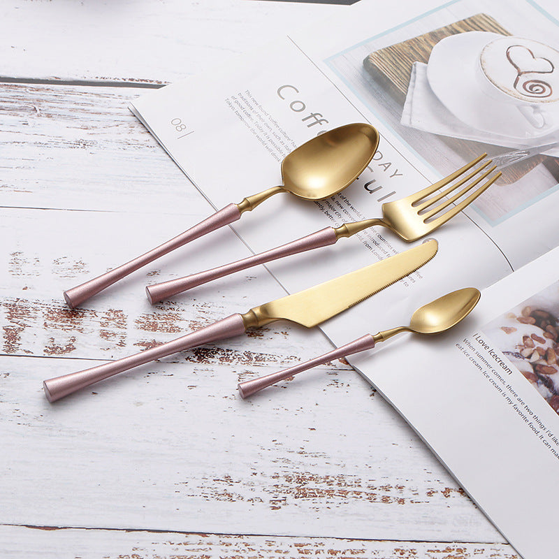 Sleek black spoon and coffee spoon with golden heads