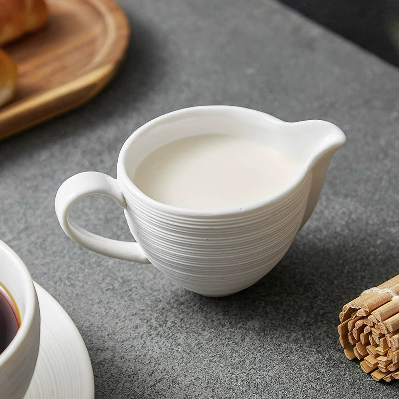 Small pouring jug for milk, cream, or juice