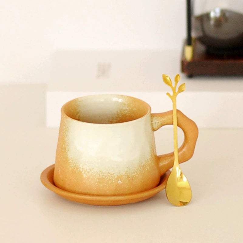 Spoon resting on rustic saucer beside stoneware mug