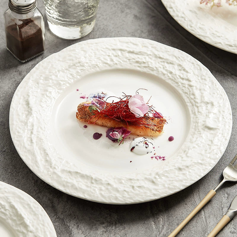 Textured ceramic plate with irregular stone-like rim