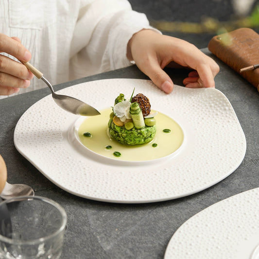 White ceramic plate with wavy rim design