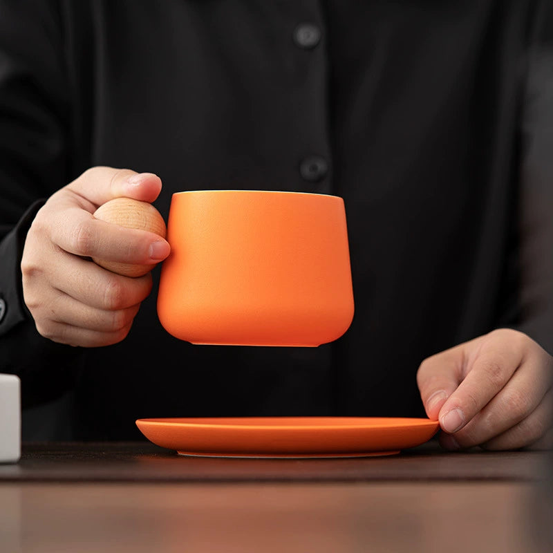 Wooden handle ceramic cup set on tabletop