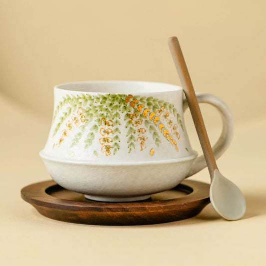 artisanal green botanical tea cup with gold leaf accents