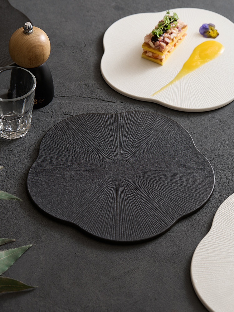 artisanal radial line textured ceramic plate in white and black