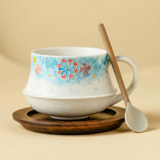 artisanal sky blue floral tea cup with gold leaf stardust accents