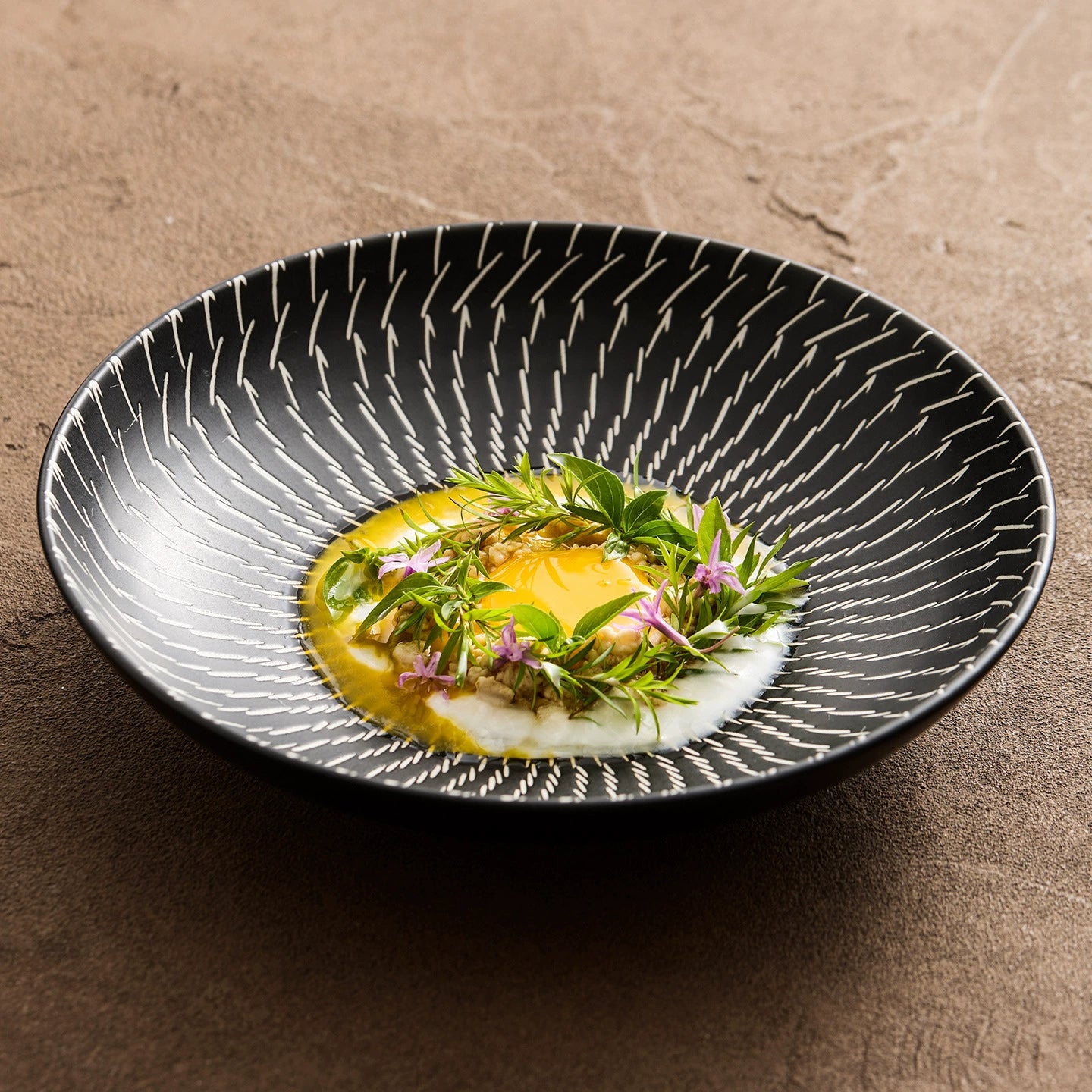 Dish with a decorative pattern on a brown surface