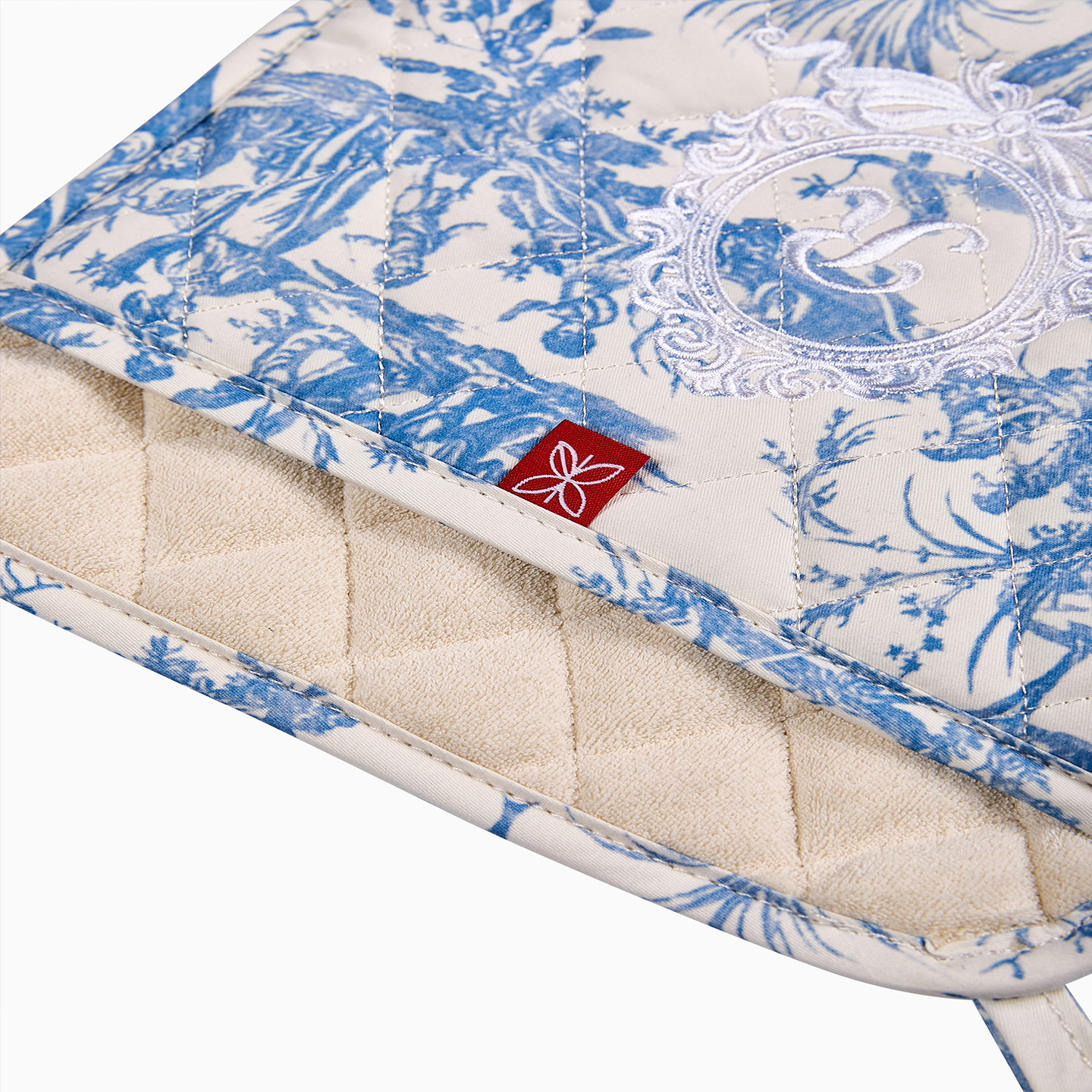 A set of two pink Toile de Jouy pot holders highlighting the 9" x 9" square silhouette.