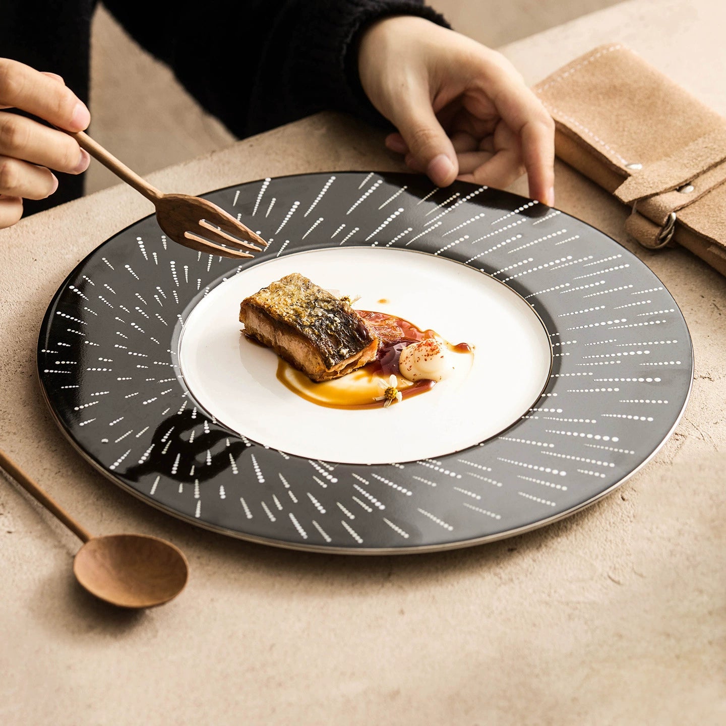 Aerial view of a celestial-themed ceramic plate with a crisp white center.