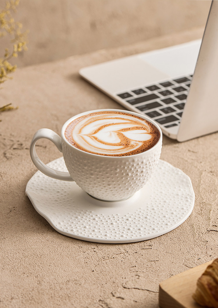 Architectural coffee set featuring a 16.5cm irregular organic saucer.